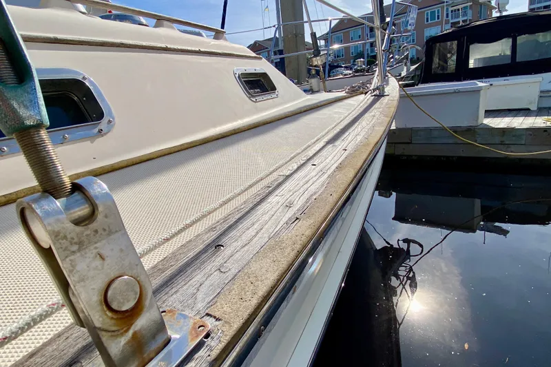 Slide: The Image of 1994 Island Packet 44 sailboat docked, showing deck and hardware details. - 23
