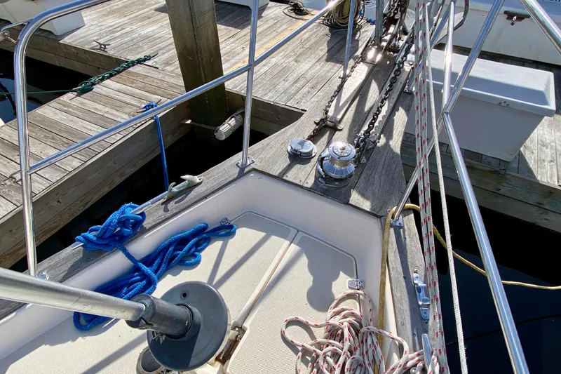 Slide: The Image of Deck of 1994 Island Packet 44 sailboat with ropes and winches at dock. - 26