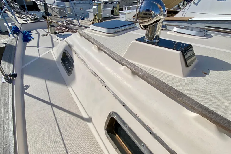 Slide: The Image of Deck view of a 1994 Island Packet 44 sailboat, showcasing sleek design and fittings. - 29