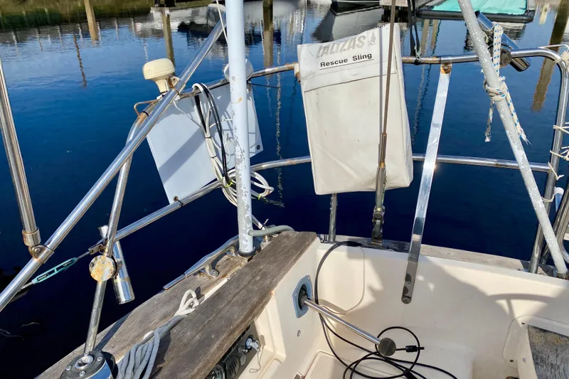 Slide: The Image of Cockpit of 1994 Island Packet 44 sailboat with rescue sling and nautical equipment. - 39