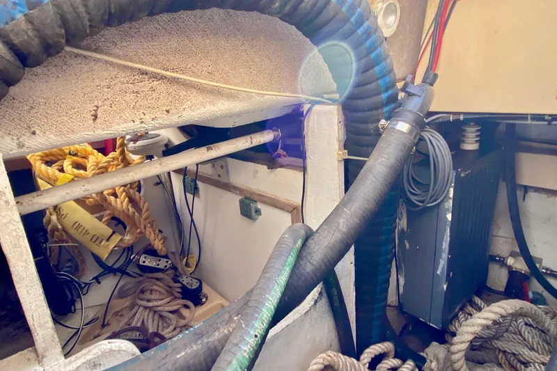 Slide: The Image of Interior view of a 1994 Island Packet 44 sailboat showing ropes and equipment. - 45