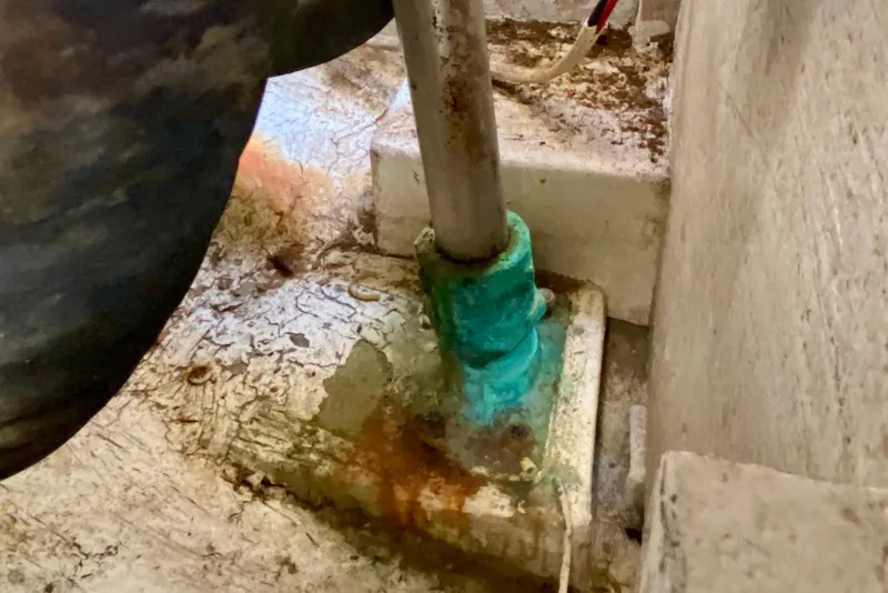 Slide: The Image of Corroded metal fitting on 1994 Island Packet 44 sailboat, showing rust and wear. - 47