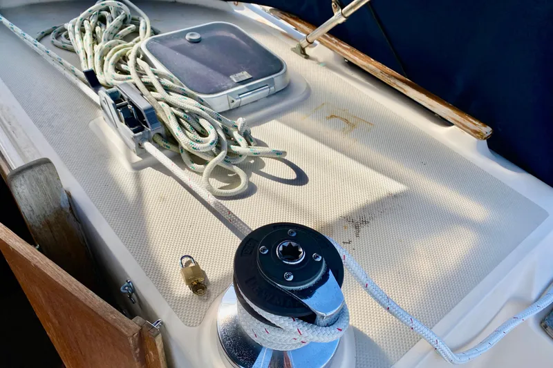 Slide: The Image of Deck of 1994 Island Packet 44 sailboat with ropes and winch. - 59