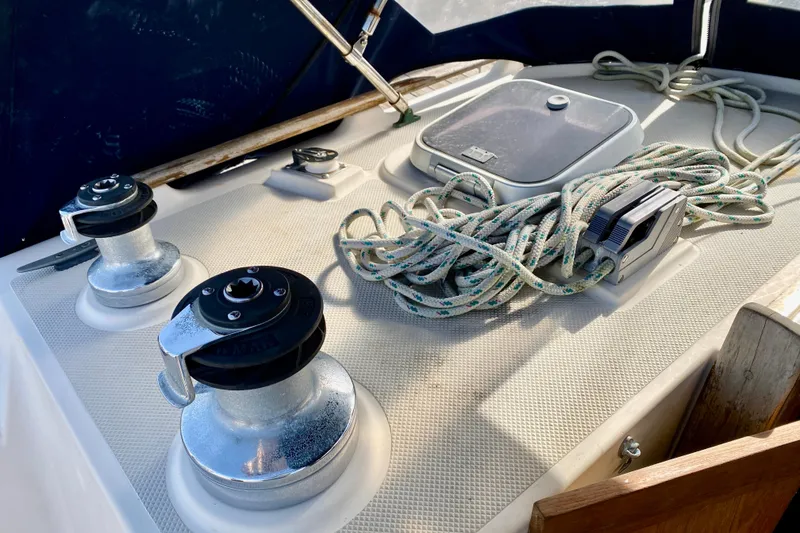 Slide: The Image of Deck of 1994 Island Packet 44 sailboat with winches and coiled ropes. - 60