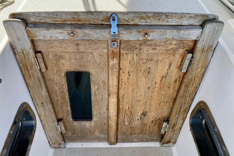 Slide: The Image of Wooden hatch door on a 1994 Island Packet 44 sailboat. - 61