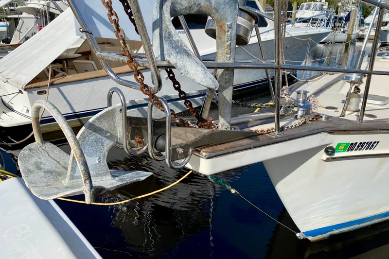 Slide: The Image of Bow of 1994 Island Packet 44 sailboat with dual anchors at marina. - 7