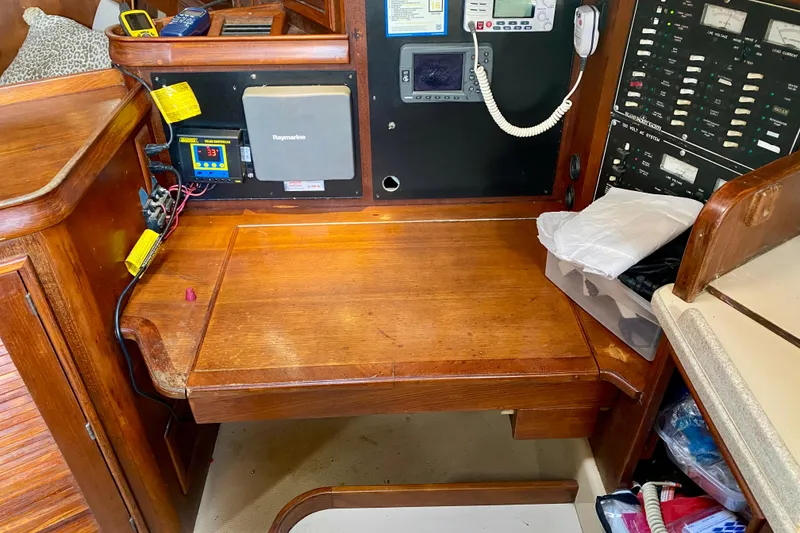 Slide: The Image of Navigation station of a 1994 Island Packet 44 sailboat with electronic equipment. - 71