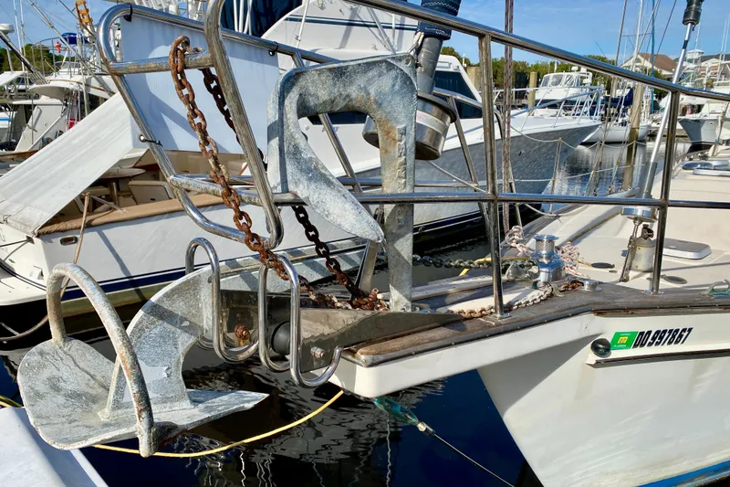 Slide: The Image of 1994 Island Packet 44 sailboat with anchor and chain at marina. - 8