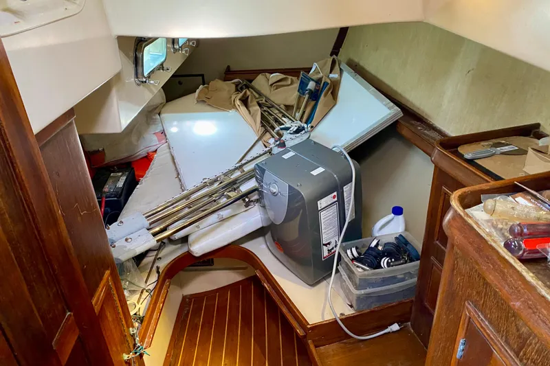 Slide: The Image of Interior of a 1994 Island Packet 44 sailboat with stored equipment and supplies. - 82
