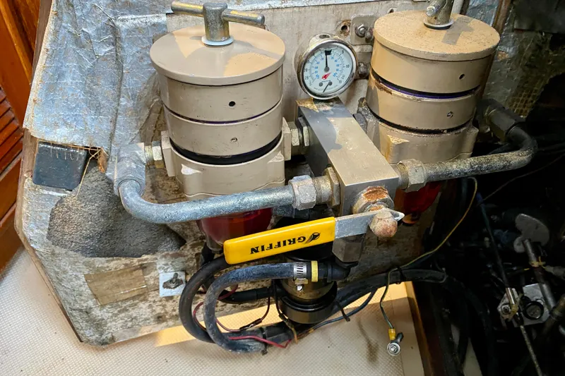 Slide: The Image of Engine compartment of a 1994 Island Packet 44 sailboat with fuel filtration system. - 90