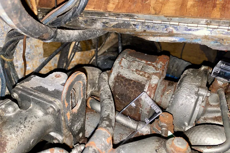 Slide: The Image of Rusty engine components of a 1994 Island Packet 44 sailboat. - 91