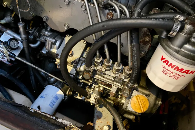 Slide: The Image of Engine components of a 1994 Island Packet 44 sailboat with Yanmar fuel filter. - 92