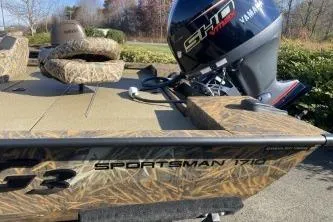 Slide: The Image of 2026 G3 Sportsman 1710 PFX boat with Yamaha motor, camo design, outdoor setting. - 3