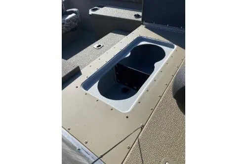 Slide: The Image of 2026 G3 Sportsman 1710 PFX boat interior with open storage compartment. - 8