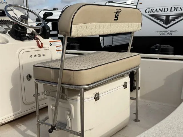 Slide: The Image of Bench seat on a 2020 Carolina Skiff 19SWS boat, featuring integrated cooler. - 18