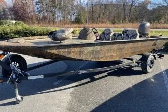 The Image of 2026 G3 Sportsman 1710 PFX boat on trailer, parked outdoors. - 0