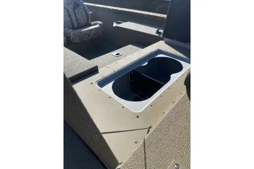 Slide: The Image of 2026 G3 Sportsman 1710 PFX boat interior with storage compartment and seating. - 2