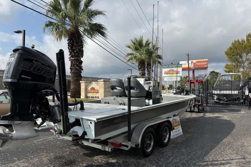 Slide: The Image of 2018 SCB Stingray boat with Mercury 300 engine on trailer at dealership. - 1