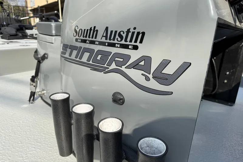 Slide: The Image of 2018 SCB Stingray boat with South Austin Marine branding, featuring rod holders. - 10