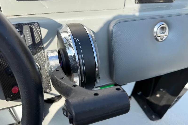 Slide: The Image of 2018 SCB Stingray boat throttle control and dashboard detail. - 16