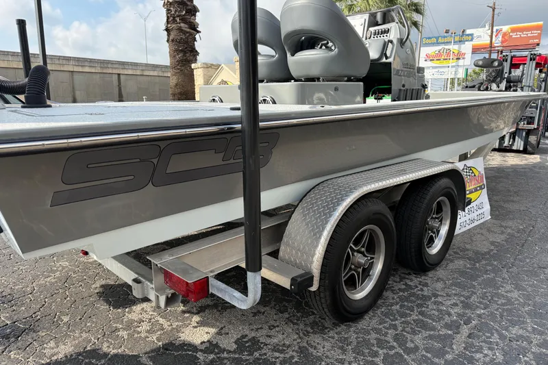 Slide: The Image of 2018 SCB Stingray boat on trailer at South Austin Marine dealership. - 2