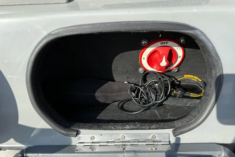 Slide: The Image of 2018 SCB Stingray compartment with red power switch and tangled cables. - 21