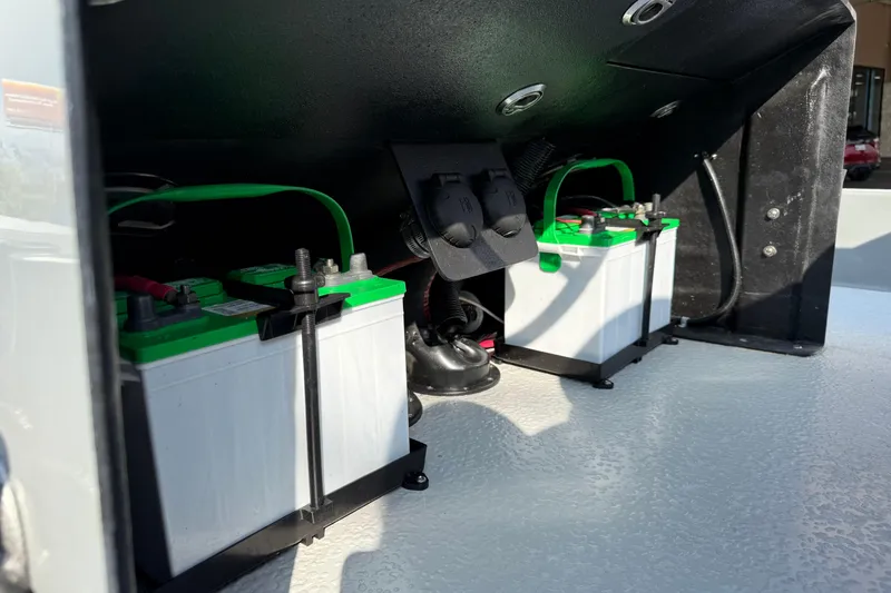 Slide: The Image of 2018 SCB Stingray boat battery compartment with dual batteries and wiring. - 22