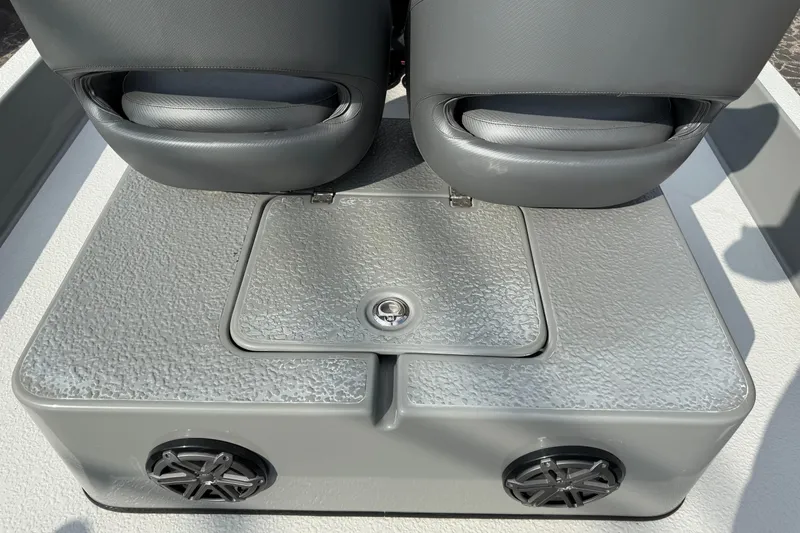 Slide: The Image of 2018 SCB Stingray boat seating area with storage compartment and speakers. - 30