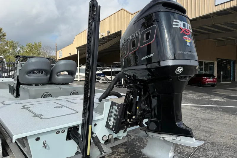 Slide: The Image of 2018 SCB Stingray boat with Mercury 300 XS outboard motor in a marina setting. - 4