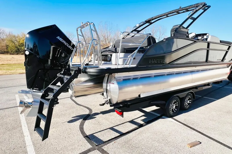 Slide: The Image of 2026 Harris Grand Mariner 230 pontoon boat with Mercury engine on trailer. - 10