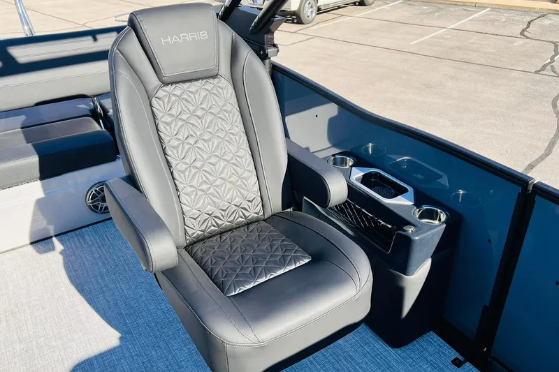 Slide: The Image of Luxurious seating on 2026 Harris Grand Mariner 230 boat, featuring elegant design and cup holders. - 18