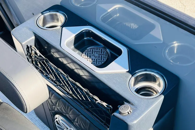Slide: The Image of 2026 Harris Grand Mariner 230 boat console with cup holders and storage net. - 19