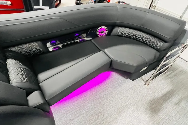 Slide: The Image of Luxurious seating on the 2026 Harris Grand Mariner 230 with ambient purple lighting. - 23
