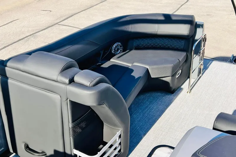 Slide: The Image of Luxurious seating on 2026 Harris Grand Mariner 230 pontoon boat, featuring sleek black upholstery. - 29