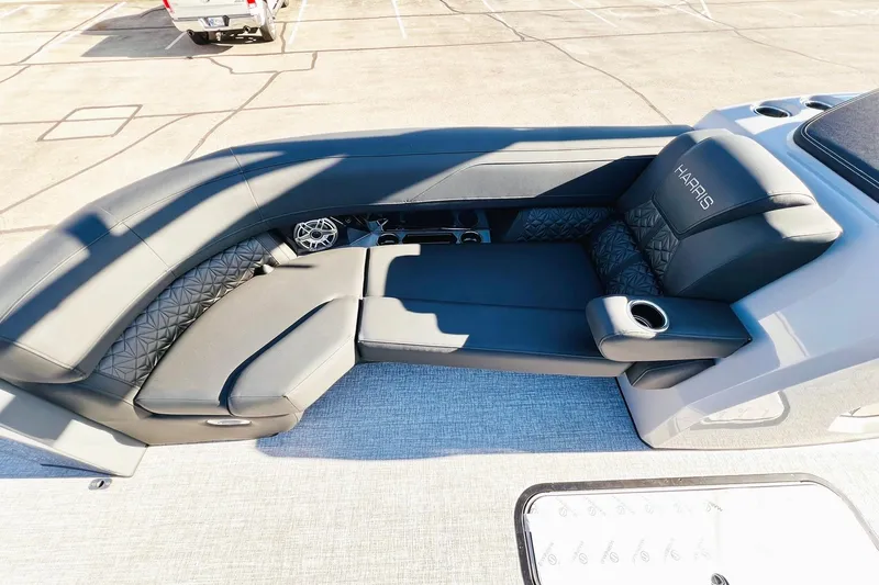 Slide: The Image of Luxurious seating on 2026 Harris Grand Mariner 230 boat, featuring sleek design and cup holders. - 31