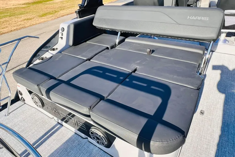 Slide: The Image of 2026 Harris Grand Mariner 230 boat with luxurious black seating and modern design. - 33