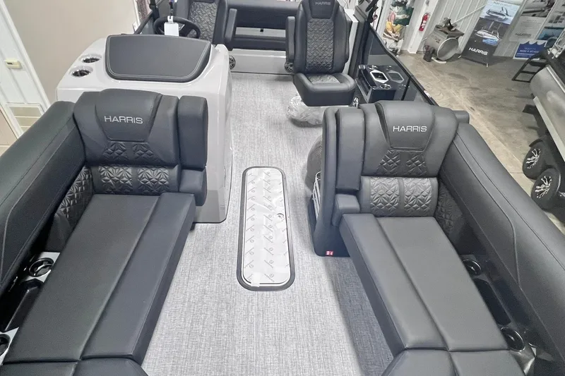 Slide: The Image of 2026 Harris Grand Mariner 230 interior with luxurious black seating and modern design. - 34