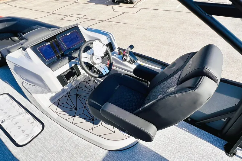 Slide: The Image of 2026 Harris Grand Mariner 230 boat cockpit with modern steering and dual screens. - 37