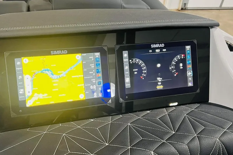 Slide: The Image of Simrad navigation displays on 2026 Harris Grand Mariner 230 boat dashboard. - 39
