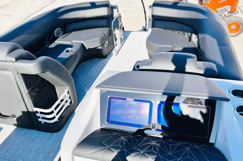 Slide: The Image of 2026 Harris Grand Mariner 230 interior with luxurious seating and modern dashboard displays. - 44