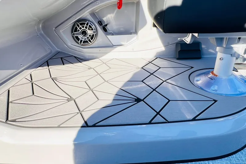 Slide: The Image of 2026 Harris Grand Mariner 230 boat interior with geometric flooring and speaker detail. - 47