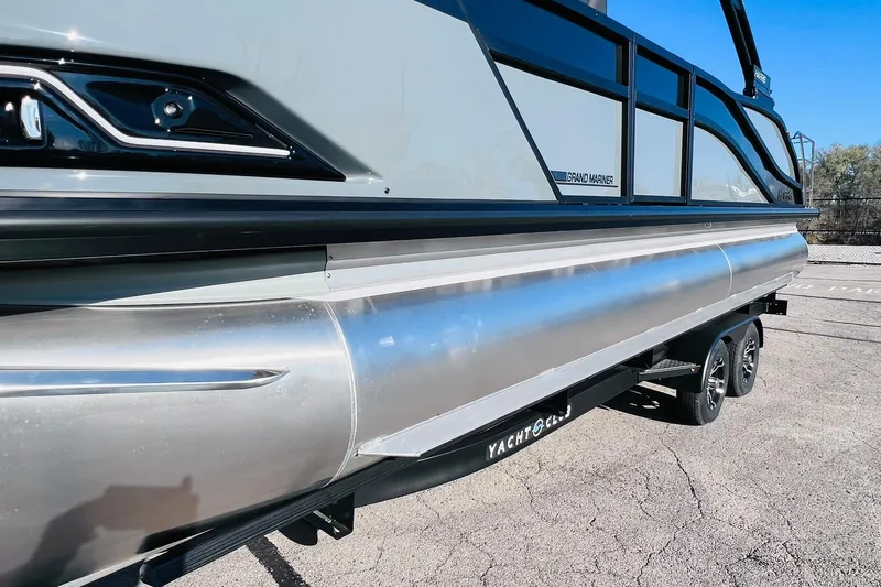 Slide: The Image of 2026 Harris Grand Mariner 230 pontoon boat on trailer, side view. - 51