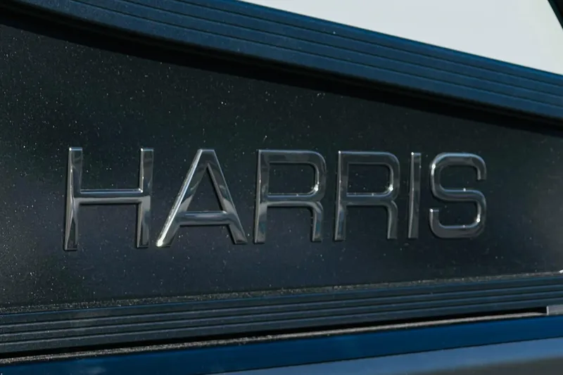 Slide: The Image of Close-up of "HARRIS" logo on 2026 Harris Grand Mariner 230 boat. - 53
