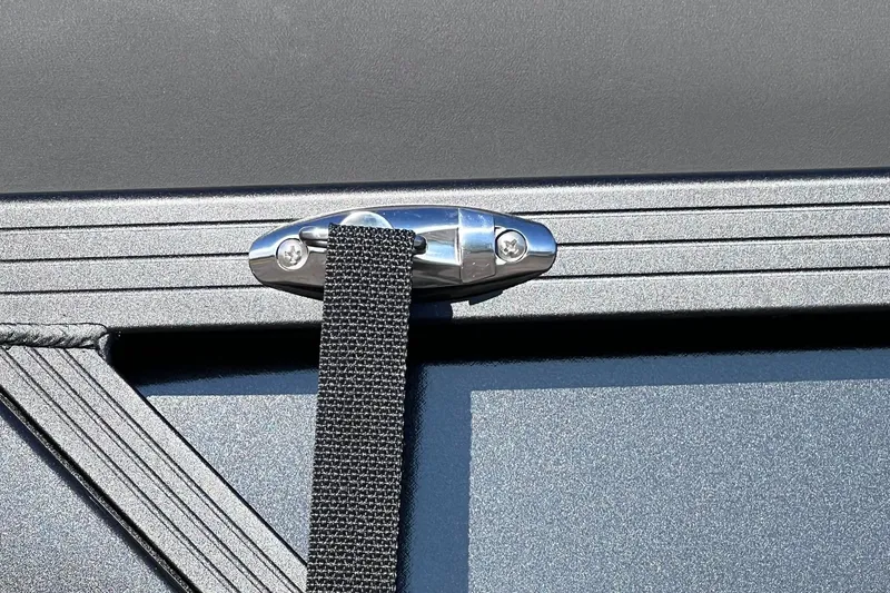 Slide: The Image of Close-up of a 2026 Harris Grand Mariner 230 boat detail with strap and metal fitting. - 55