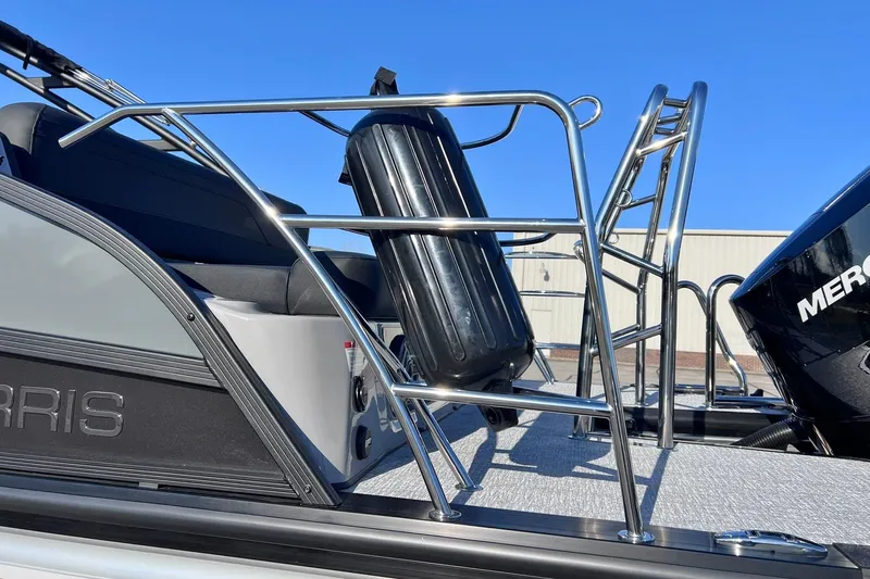 Slide: The Image of 2026 Harris Grand Mariner 230 boat with stainless steel railings and Mercury engine. - 59