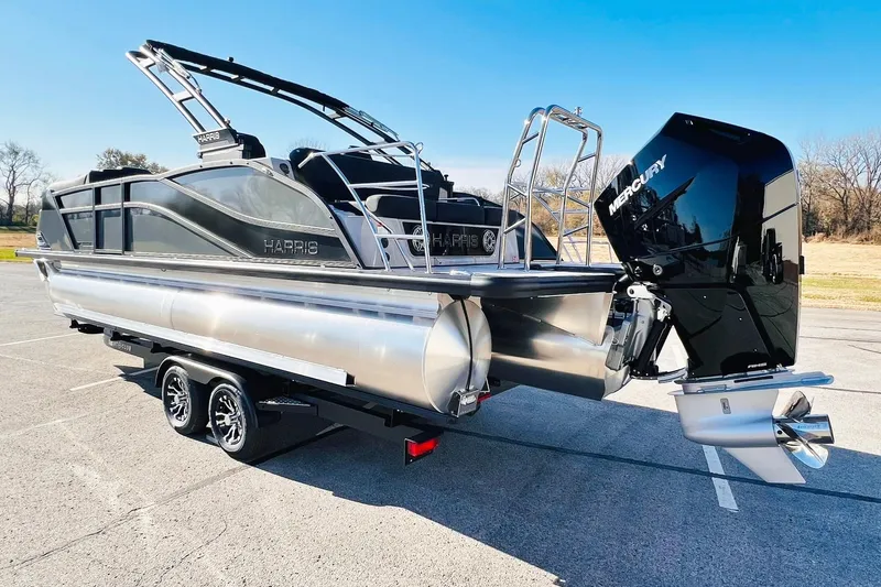 Slide: The Image of 2026 Harris Grand Mariner 230 pontoon boat with Mercury outboard engine on trailer. - 6