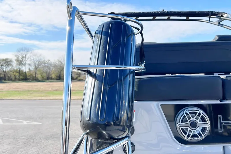 Slide: The Image of 2026 Harris Grand Mariner 230 boat with chrome railing and speaker detail. - 60