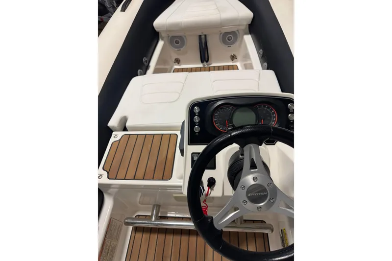 Slide: The Image of 2020 Williams Jet Tenders Sportjet 435 interior with steering wheel and dashboard. - 3