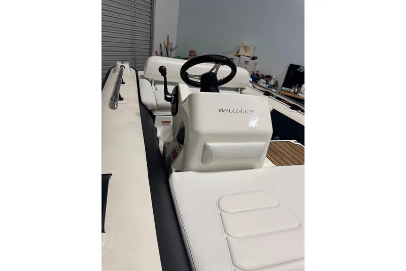 Slide: The Image of 2020 Williams Jet Tenders Sportjet 435 interior with steering wheel and seating. - 5