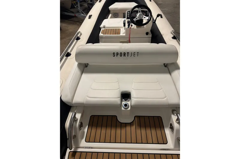 Slide: The Image of 2020 Williams Jet Tenders Sportjet 435 with white seating and teak flooring. - 7
